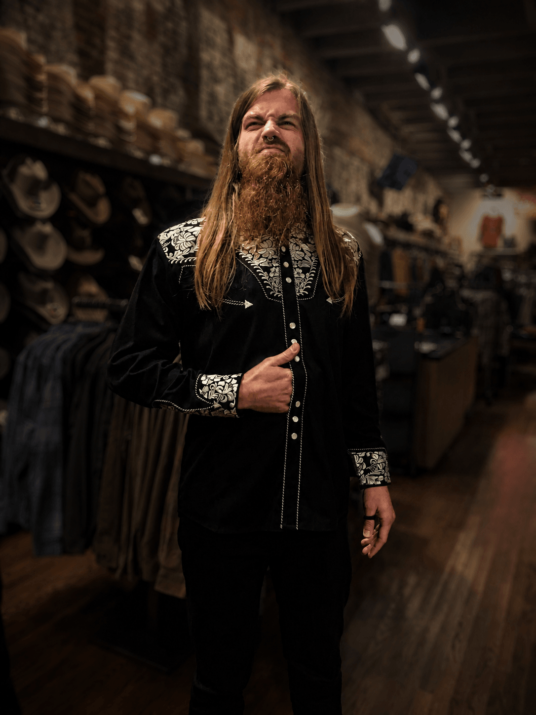 Guitar tech Alex Kettler, known as Juice, wearing an embroidered western shirt