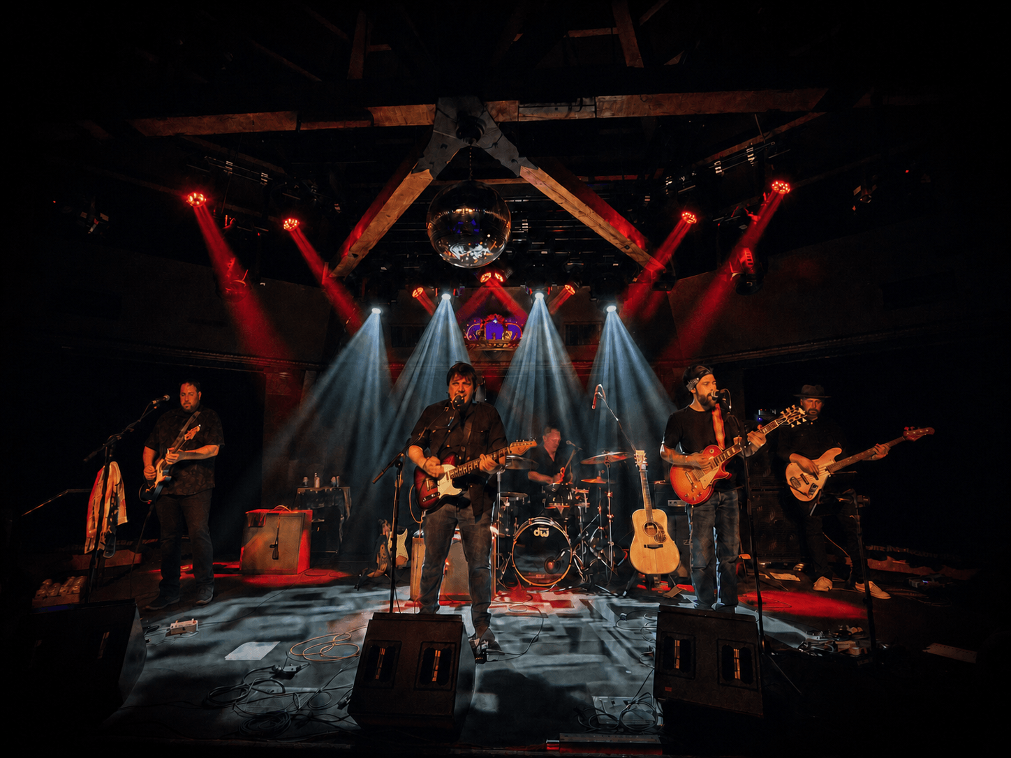 The Jackie Greene Electric Band performing in 2026: Jeremy Plog, Nathan Dale, Bruce Spencer, Jackie Greene, and Jon Cornell