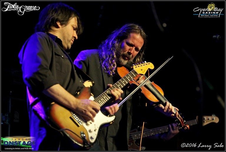 Nathan Dale playing guitar beside multi-instrumentalist Jason Crosby on violin at Crystal Bay Casino in 2016