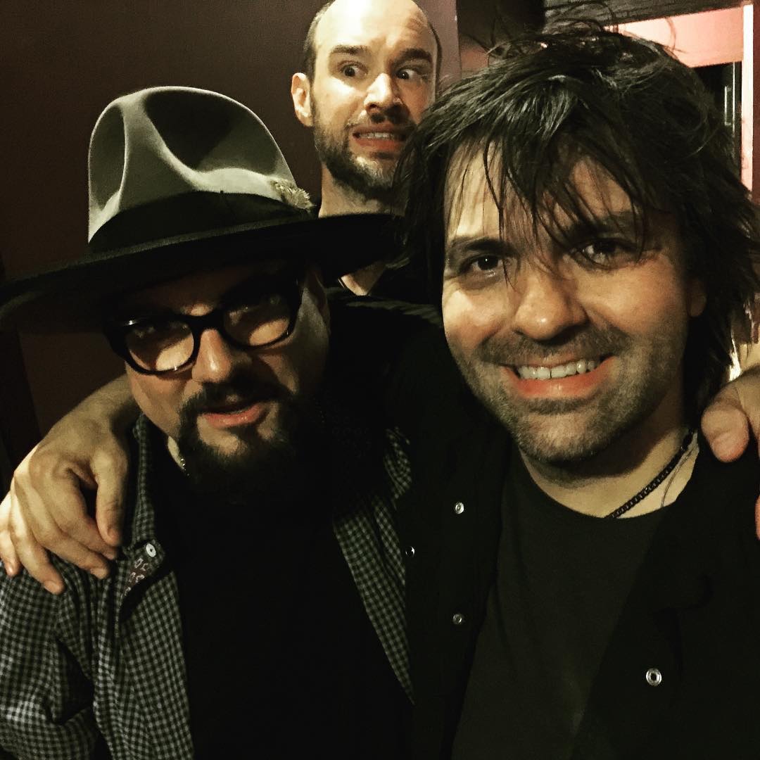 Jimmy Vivino and Nathan Dale together in 2015, with Fitz Harris photobombing behind them