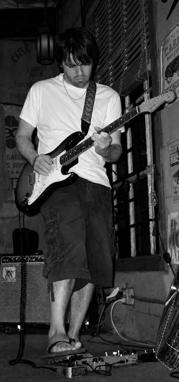 Nathan Dale playing electric guitar at the Powerhouse Pub Sunday jam session on July 20, 2003