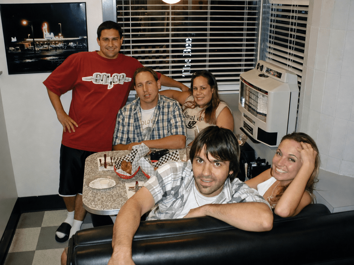Nathan Dale with his brother John Gomes, Jeremy Plog, and friends at a diner