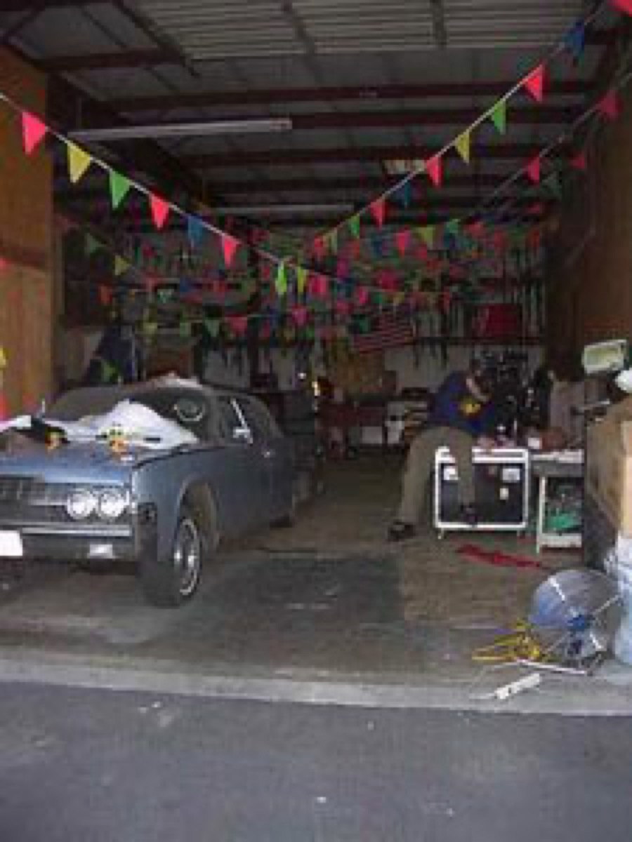 The Sweet Vine Palace rehearsal space with a car parked inside