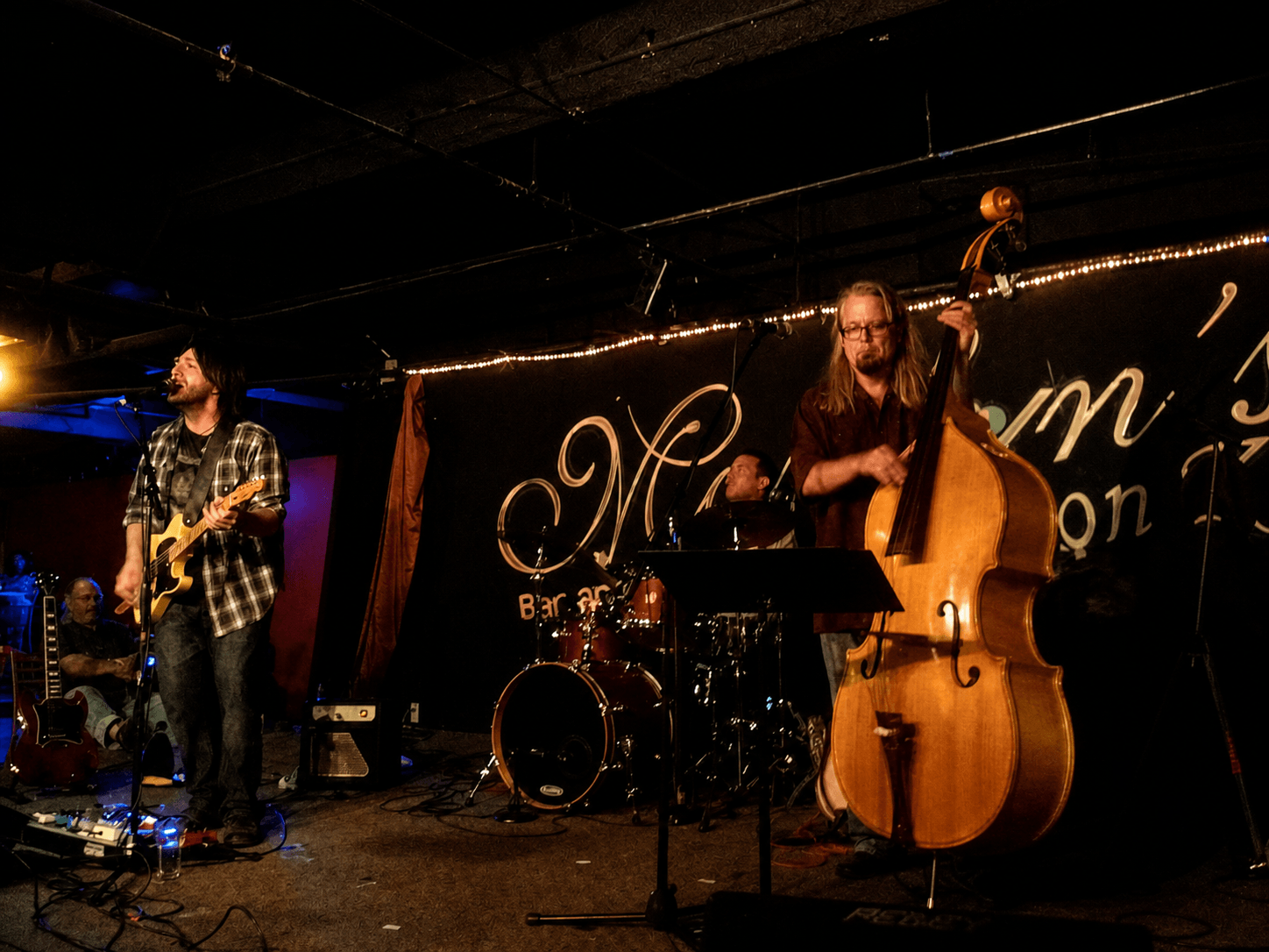 Nathan Dale performing live with Bruce Spencer on drums and Mark Harmon on upright bass during a rare Wooden Revolt appearance