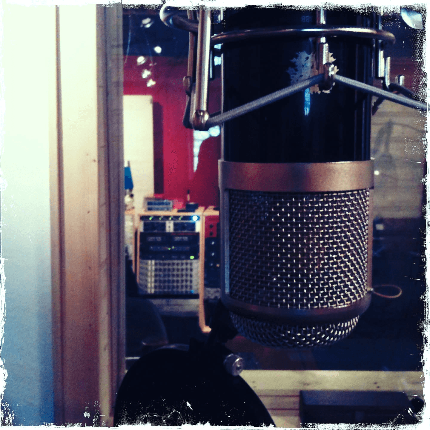CharterOak E700 studio microphone suspended in a recording room