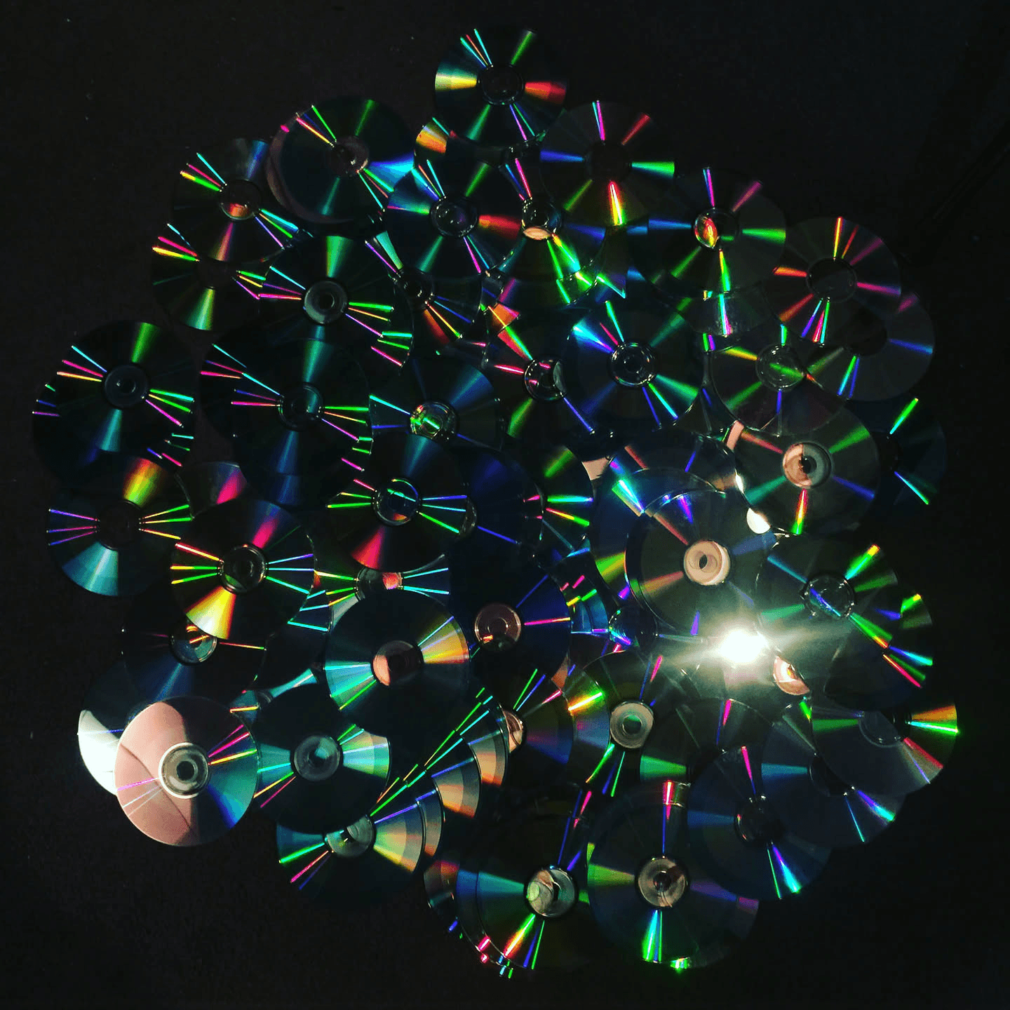 Compact discs reflecting prismatic light